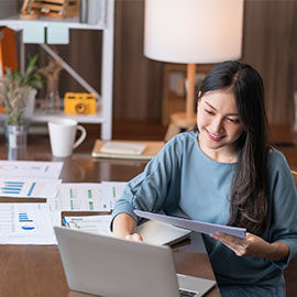 woman working on financial plans at home