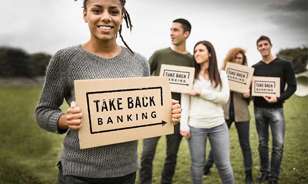 group of young people holding Take Back Banking signs
