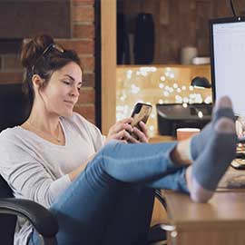 woman relaxing while using digital banking